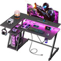 Korfile 40 Inch Gaming Desk with Power Outlet, LED, Carbon Fiber Black